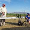 Award ceremony table with Arnold as the MC and Hodes and Toews as enthusiastic assistants